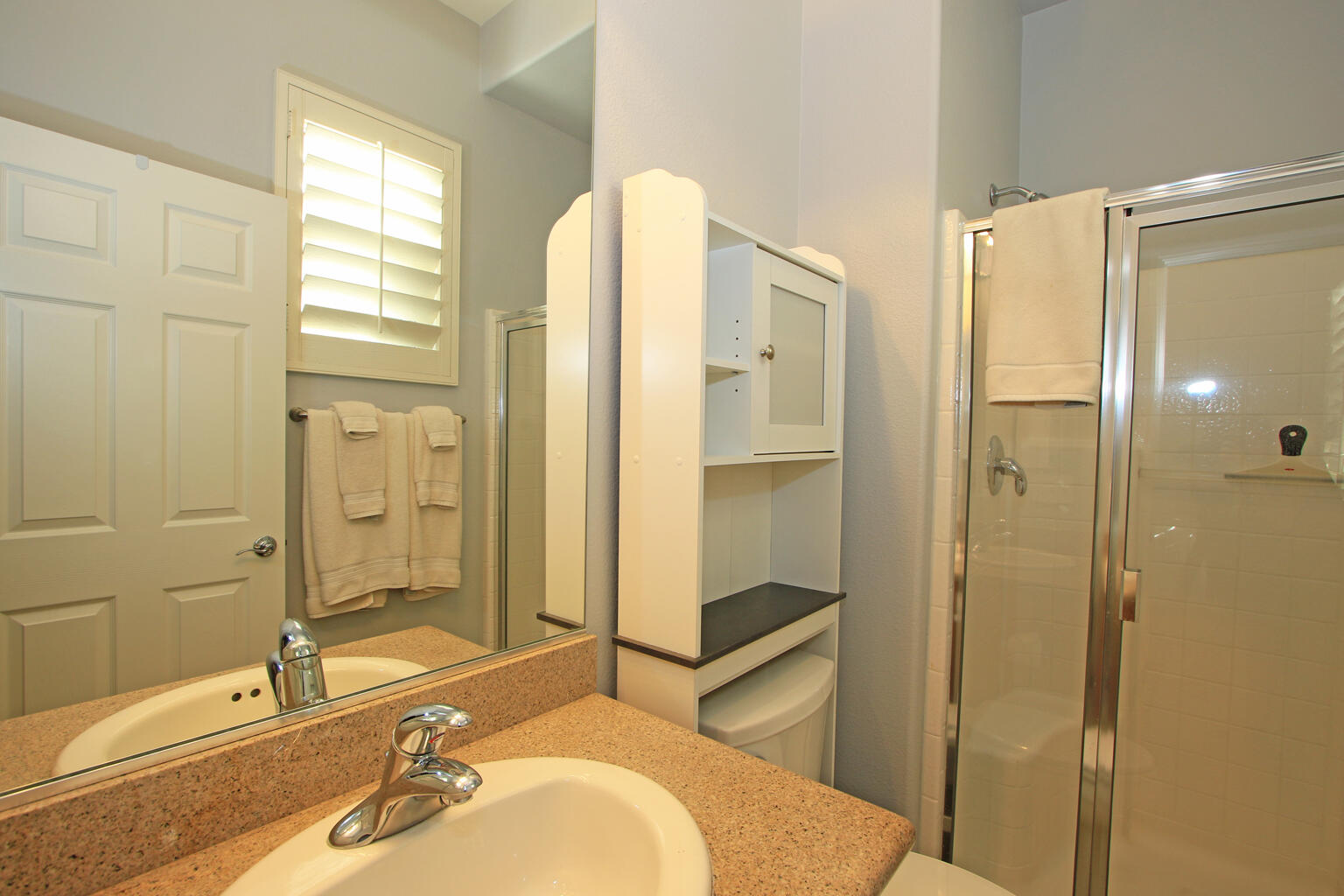 82652 Sky View Lane Indio, CA 92201 - Photo 30 of 44 a bathroom with a tub shower sink and mirror