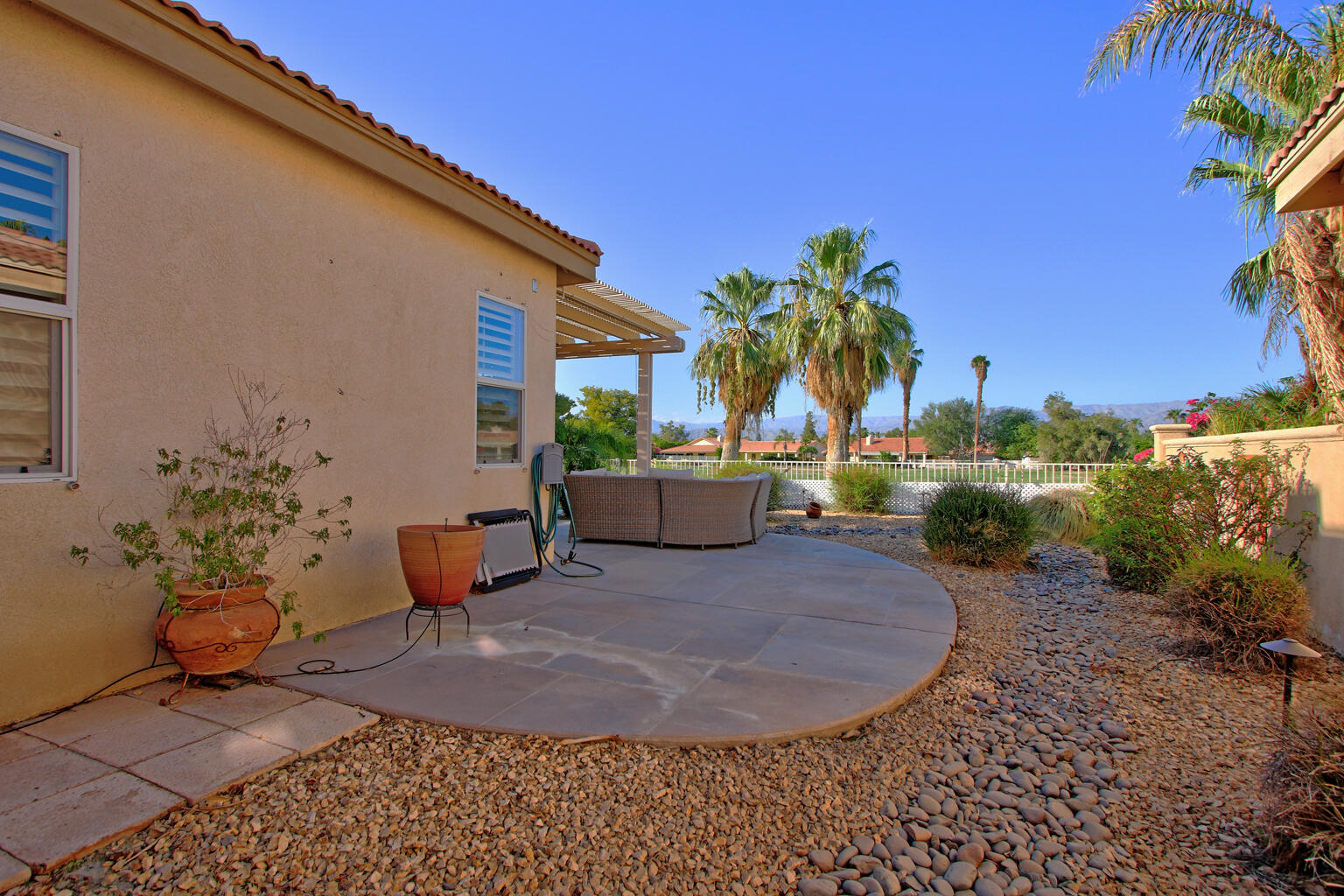 82652 Sky View Lane Indio, CA 92201 - Photo 43 of 44 a backyard of a house with seating space