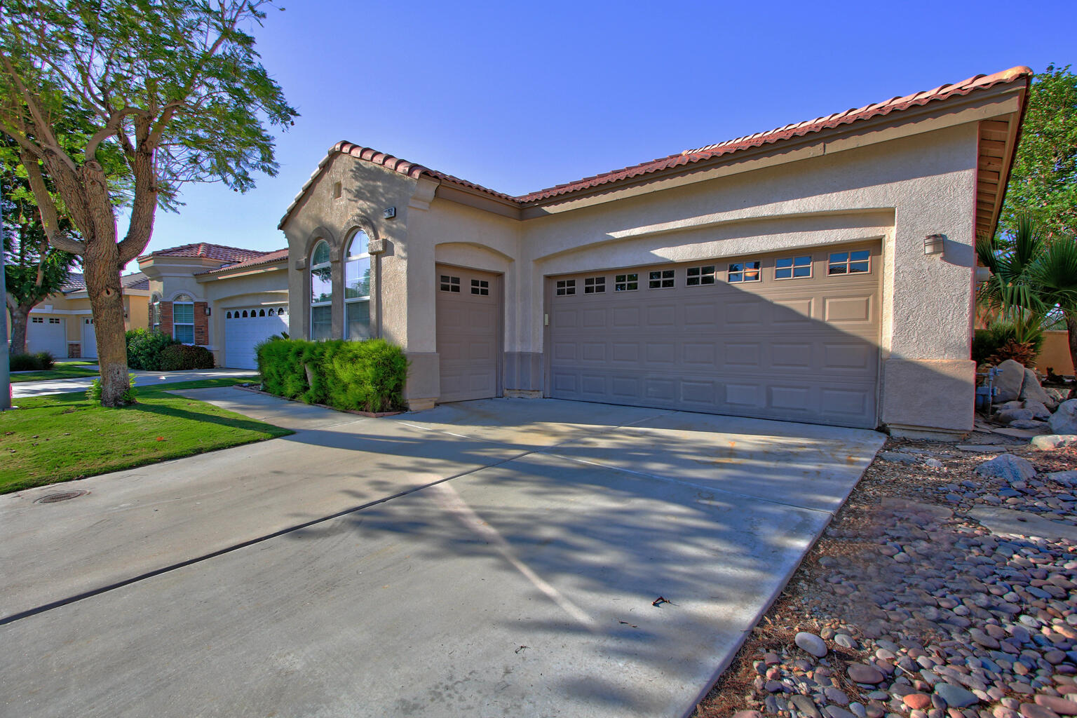 82652 Sky View Lane Indio, CA 92201 - Photo 44 of 44 a front view of a house with a yard