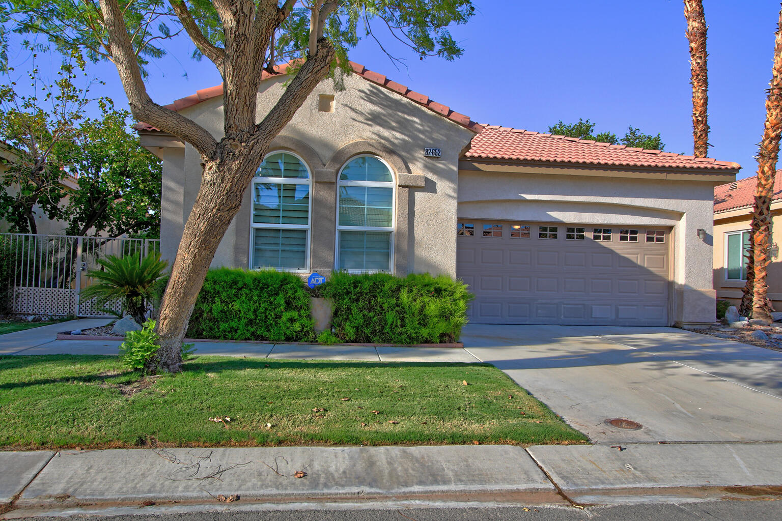 82652 Sky View Lane Indio, CA 92201 - Photo 6 of 44 a front view of a house with a yard