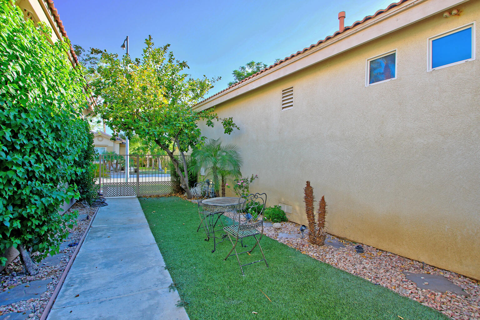 82652 Sky View Lane Indio, CA 92201 - Photo 8 of 44 a front view of a house with garden