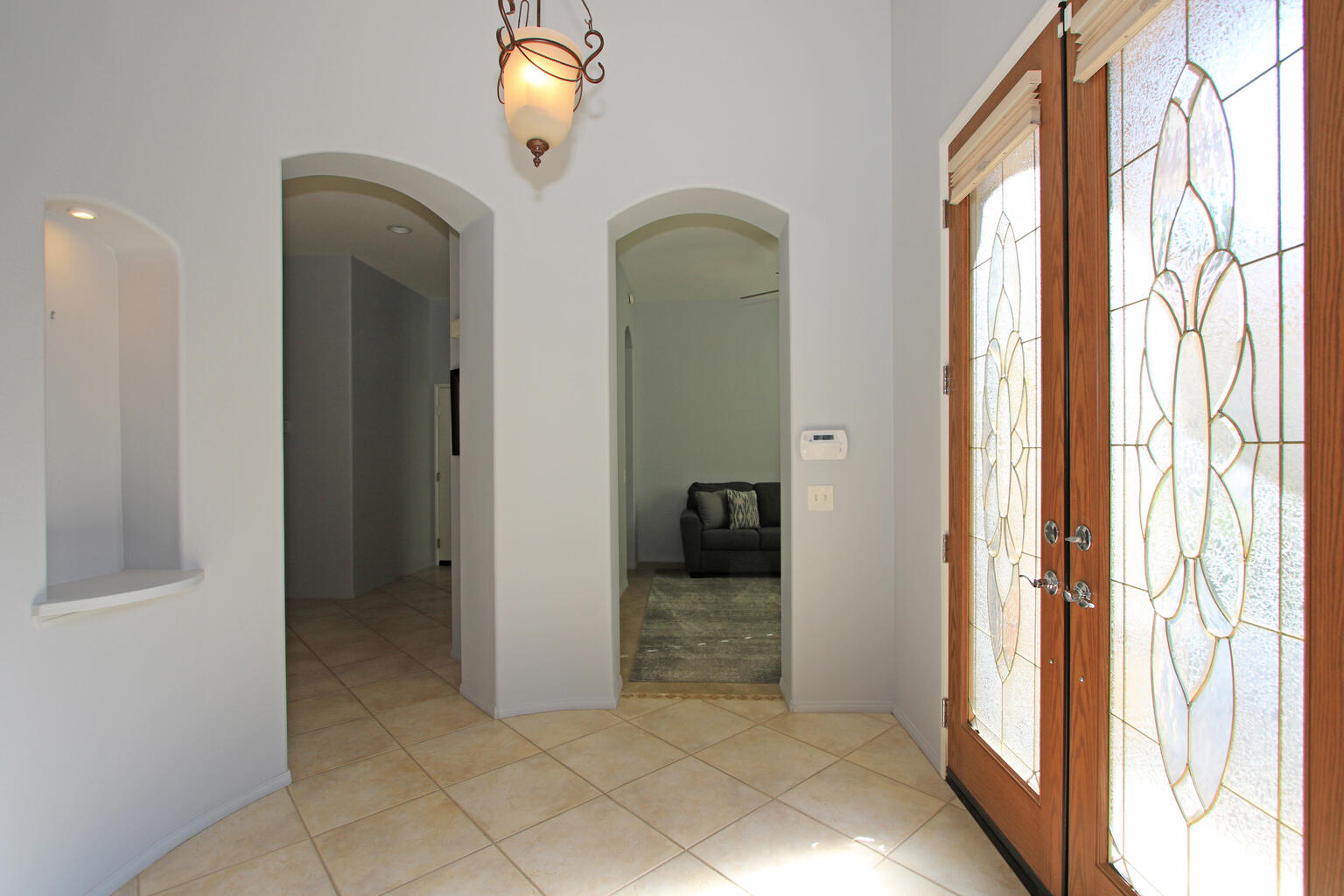 82652 Sky View Lane Indio, CA 92201 - Photo 10 of 44 a view of a hallway with wooden floor