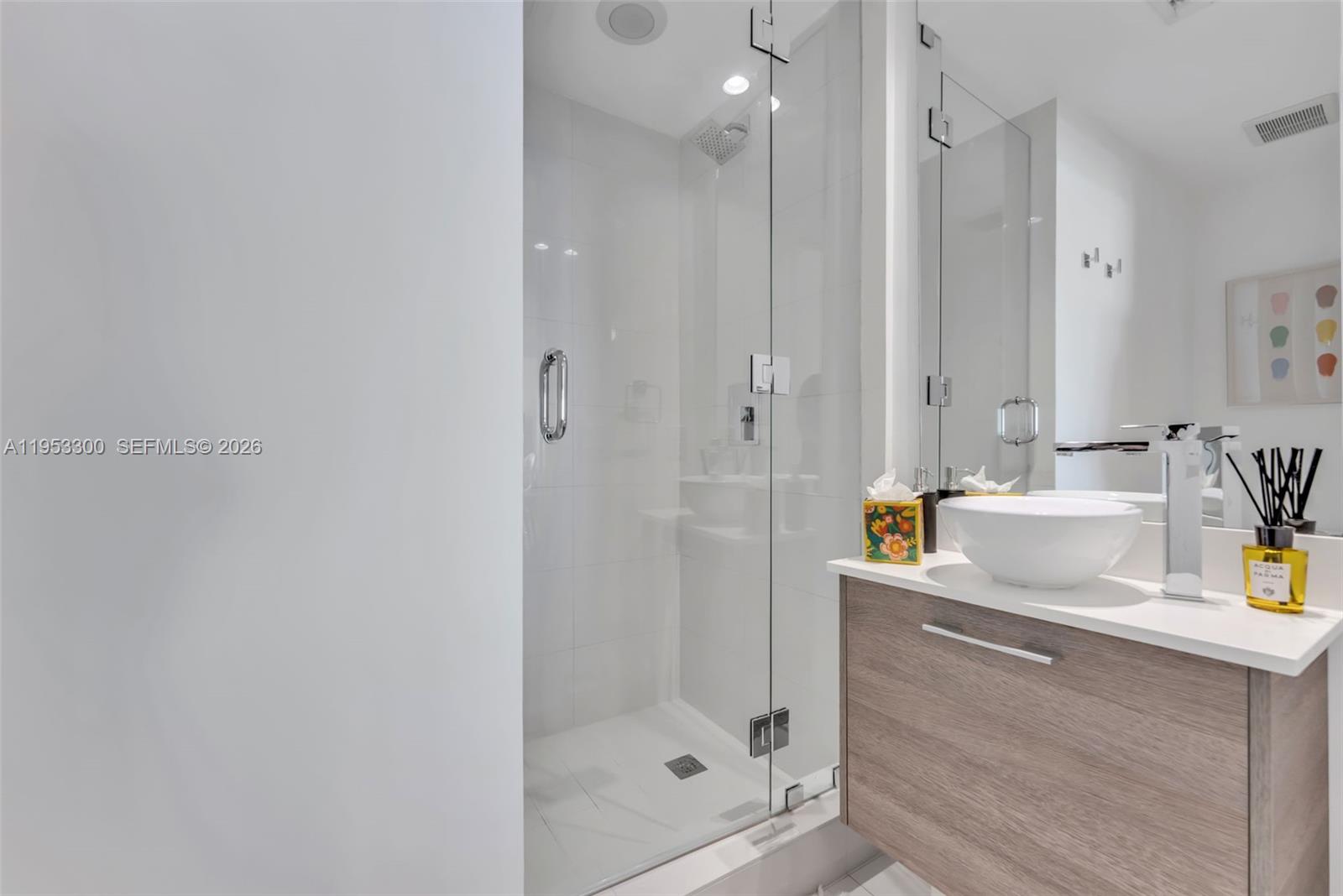 650 Northeast 32nd Street, Unit 2703 Miami, FL 33137 - Photo 17 of 51 a bathroom with a shower and a sink