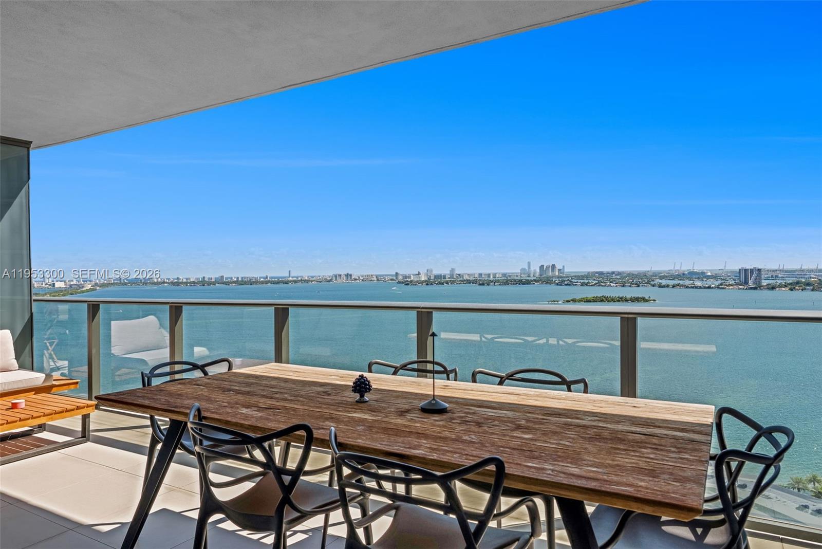 650 Northeast 32nd Street, Unit 2703 Miami, FL 33137 - Photo 3 of 51 a view of a balcony with table and chairs