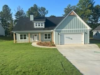 160 Walton Path Temple, GA 30179 - Photo 1 of 1 a front view of a house with a yard and garage