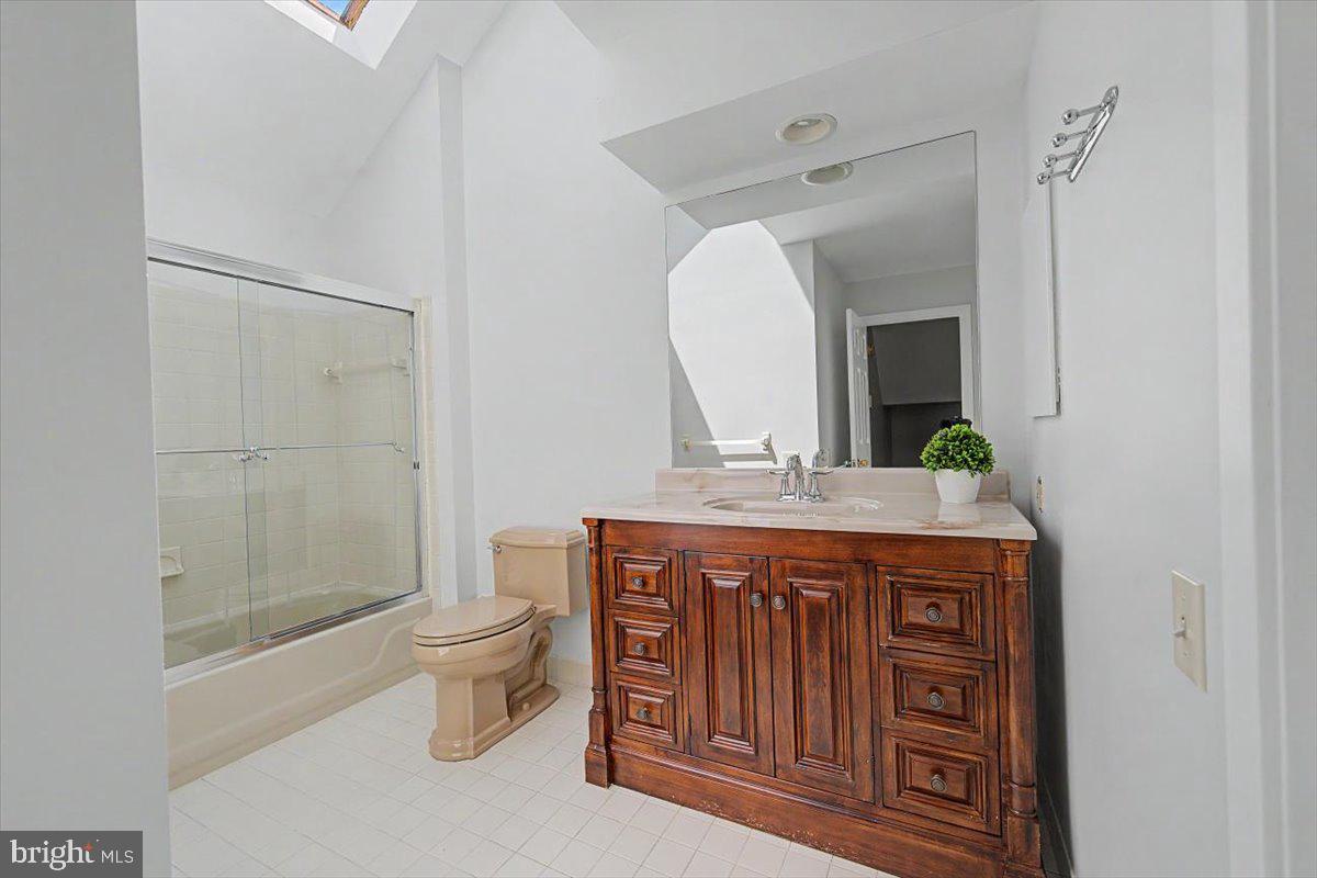 5 Steeplechase Road Wilmington, DE 19808 - Photo 23 of 39 a bathroom with a granite countertop sink a toilet and a mirror