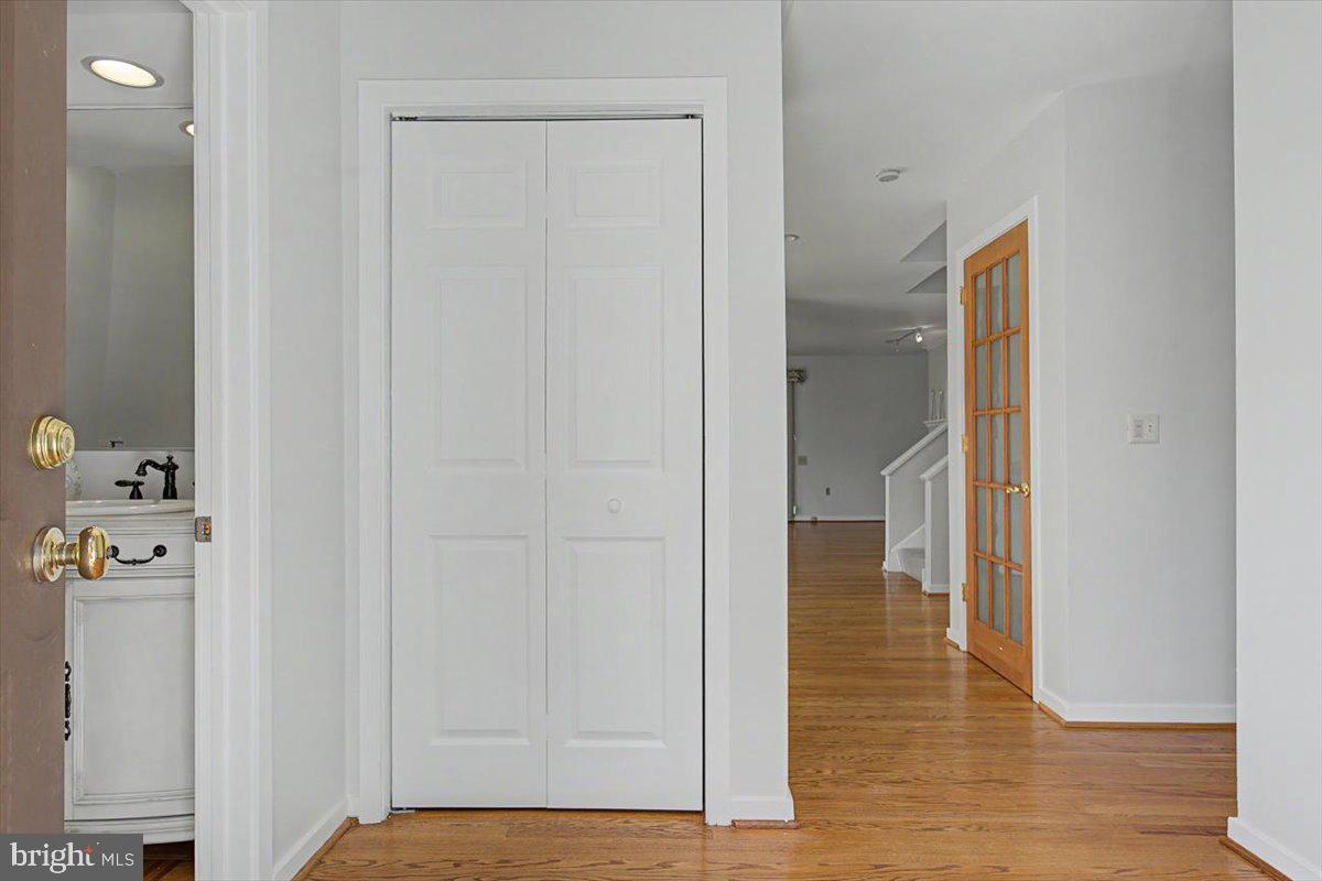 5 Steeplechase Road Wilmington, DE 19808 - Photo 5 of 39 a view of a hallway with wooden floor