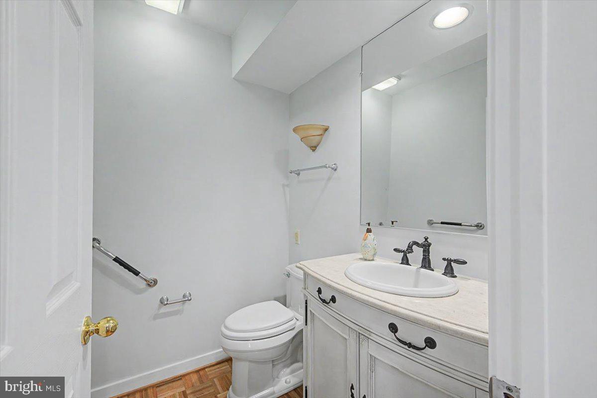 5 Steeplechase Road Wilmington, DE 19808 - Photo 6 of 39 a bathroom with a sink toilet and vanity