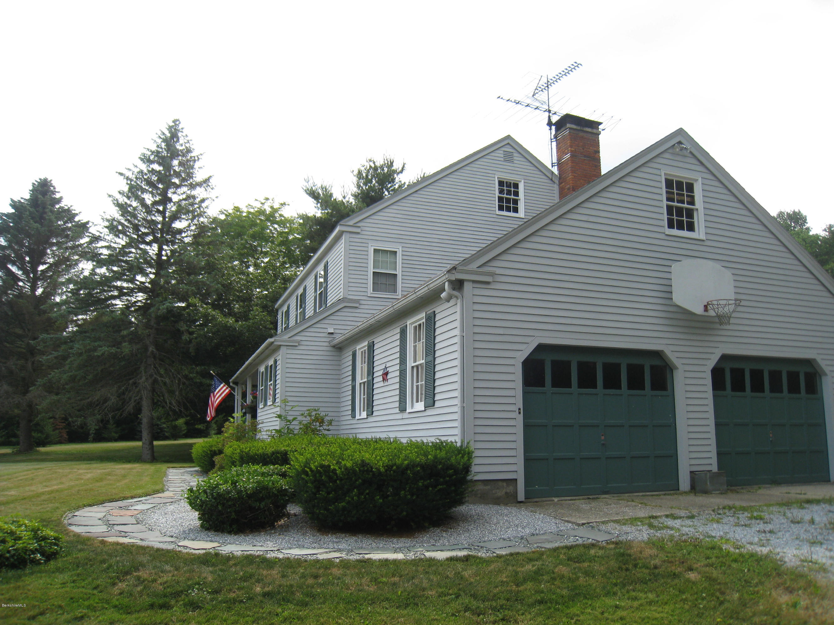 151 Old Post Road Richmond, MA 01201 - Photo 15 of 39 front view of a house with a yard