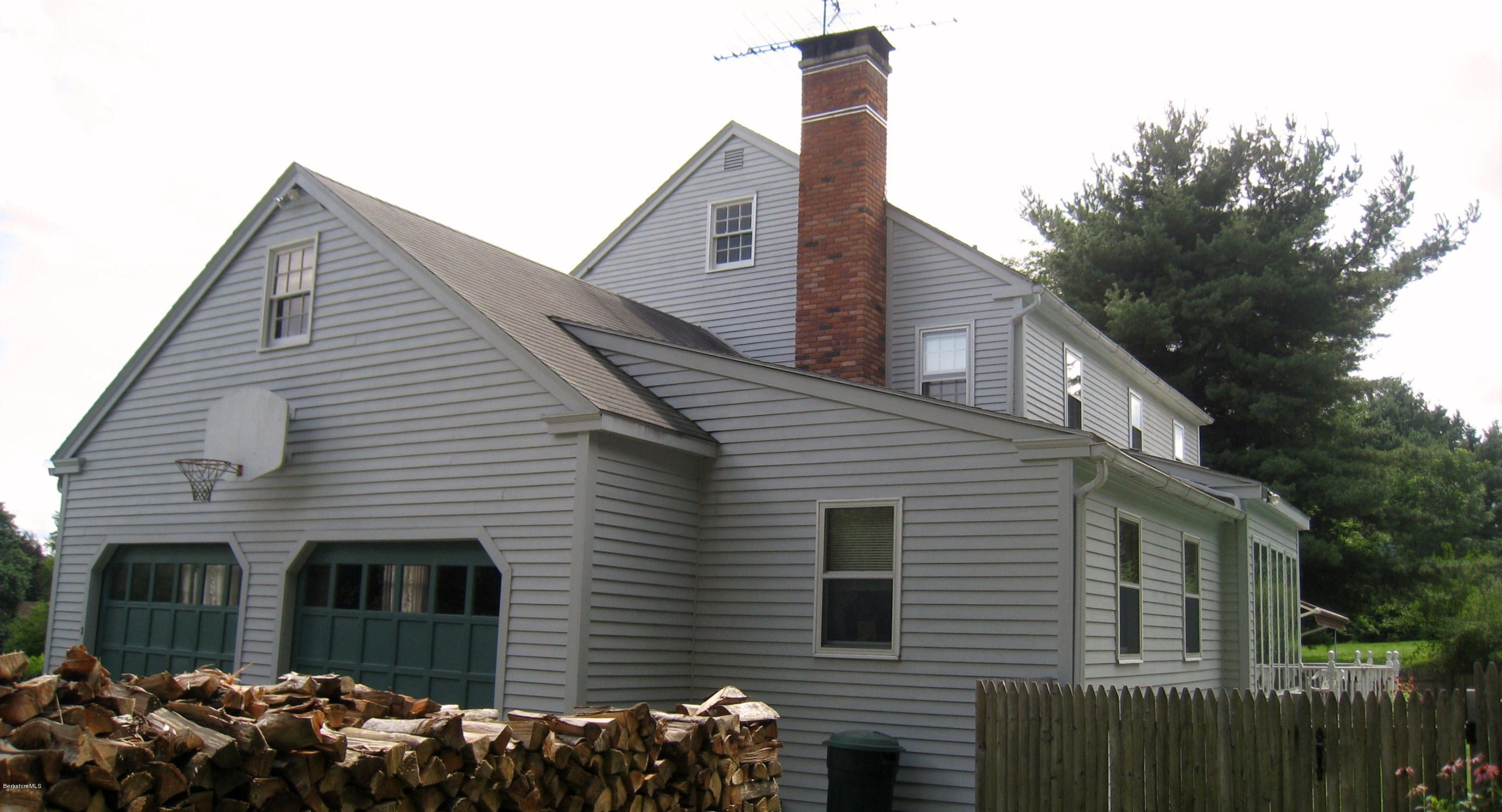 151 Old Post Road Richmond, MA 01201 - Photo 16 of 39 a front view of a house with a garden