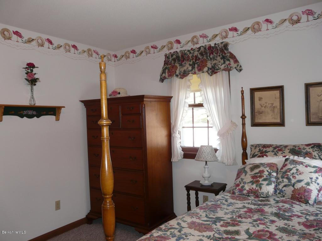 151 Old Post Road Richmond, MA 01201 - Photo 23 of 39 a bedroom with a bed and a window