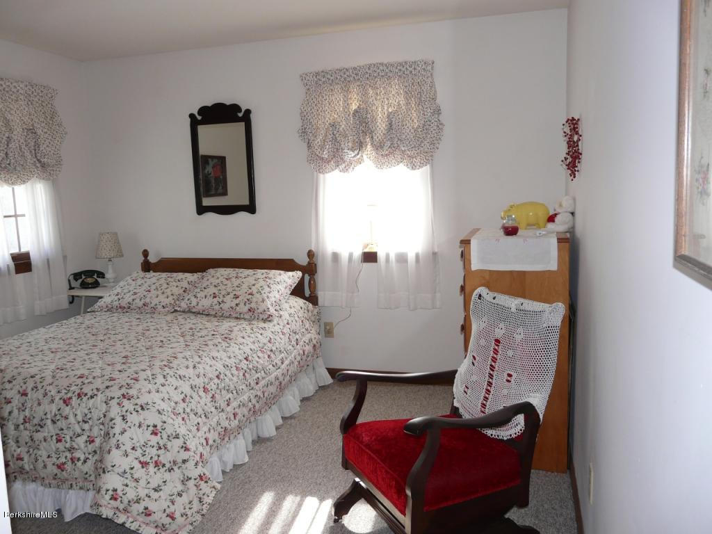 151 Old Post Road Richmond, MA 01201 - Photo 25 of 39 a bedroom with bed and window