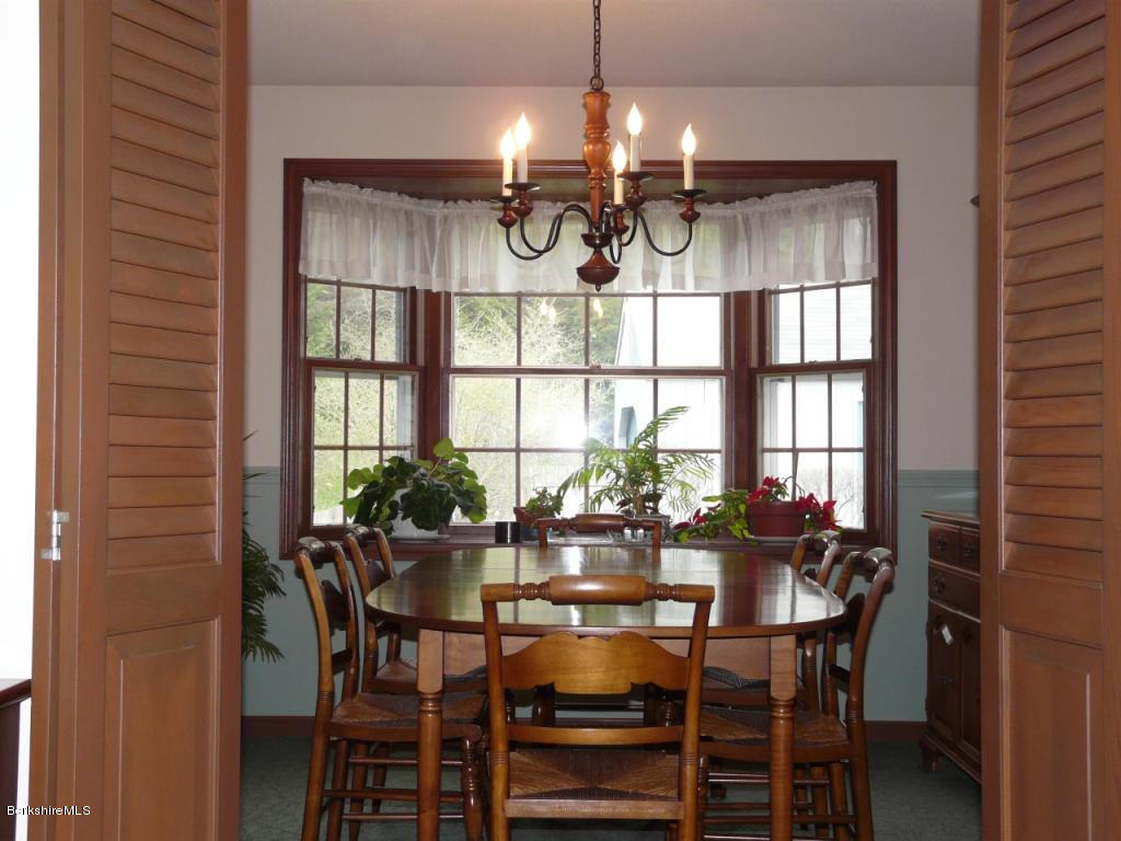 151 Old Post Road Richmond, MA 01201 - Photo 31 of 39 a view of a dining room with furniture and window