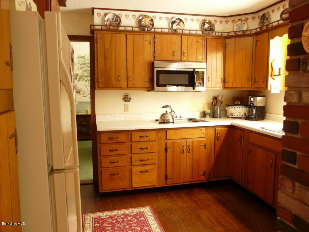 151 Old Post Road Richmond, MA 01201 - Photo 7 of 39 a kitchen with stainless steel appliances a refrigerator and a sink