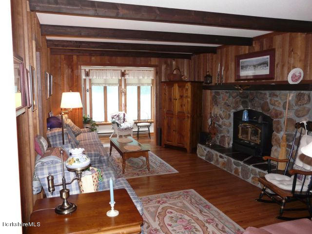 151 Old Post Road Richmond, MA 01201 - Photo 9 of 39 a living room with furniture and a fireplace