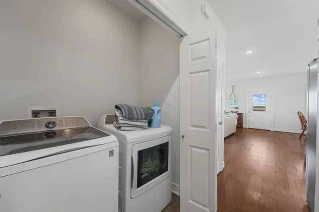 a bathroom with a sink toilet double vanity and shower