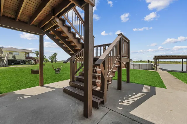 a view of a patio with a table and chairs