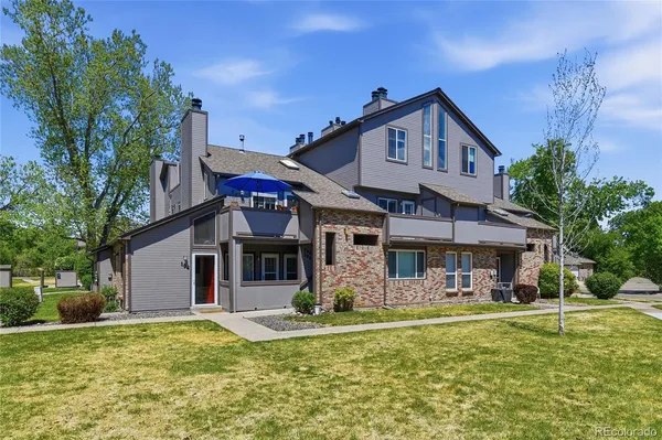 a front view of a house with swimming pool having outdoor seating