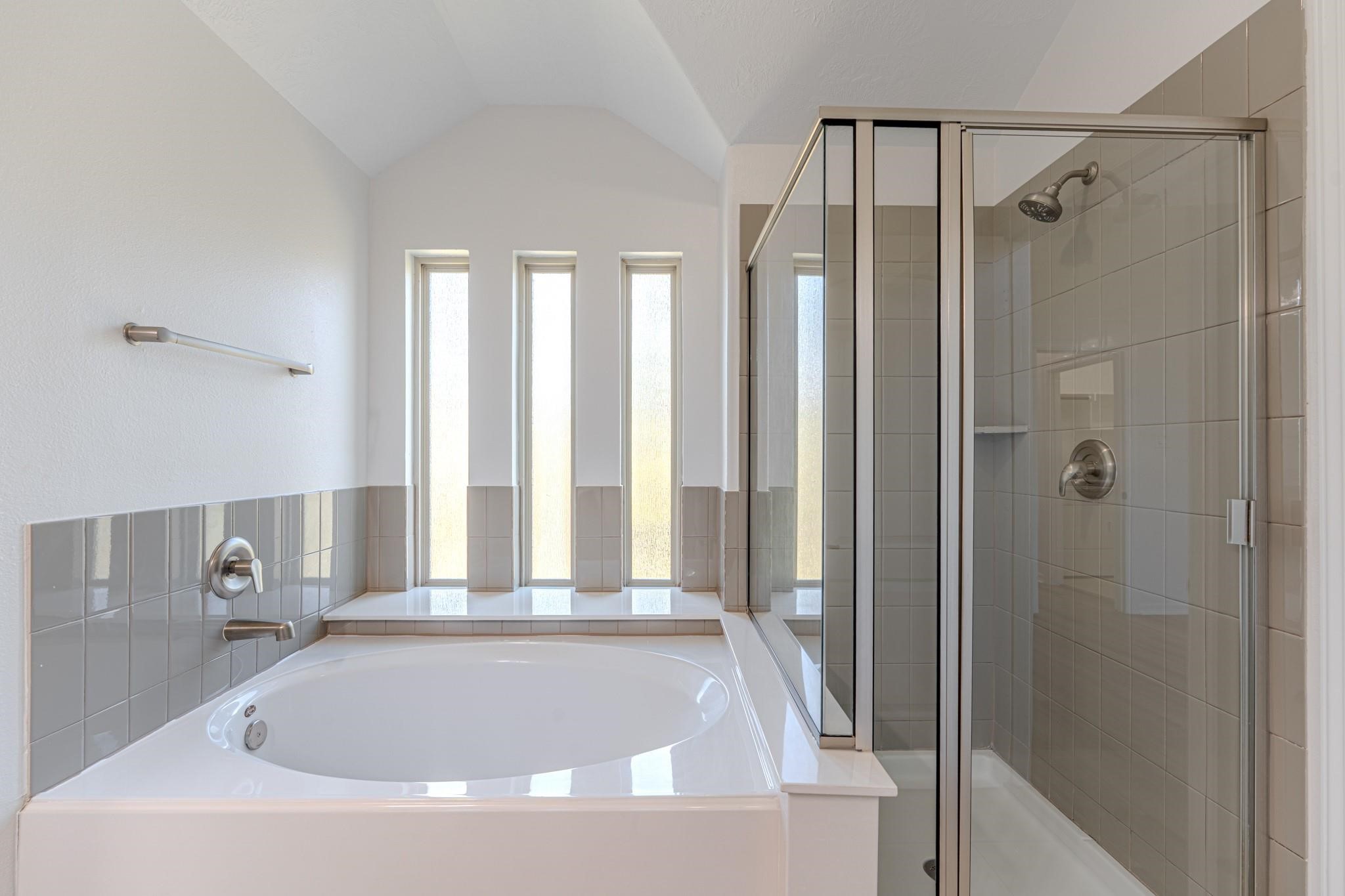 58 Aventura Place Spring, TX 77389 - Photo 21 of 23 a bathroom with a shower and a bathtub