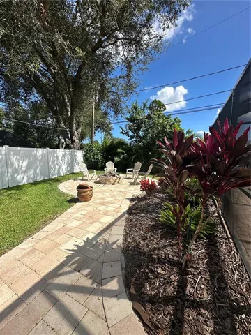 a view of yard with outdoor seating