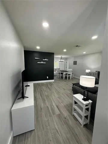 a lobby with furniture and a table