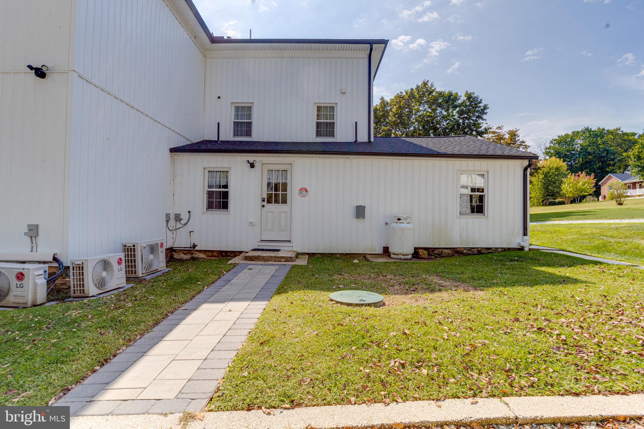 203 Blythedale Road Perryville, MD 21903 - Photo 101 of 104 a view of a white house with a yard and garage