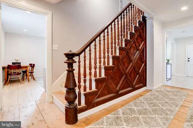 a bathroom with a sink toilet vanity and shower