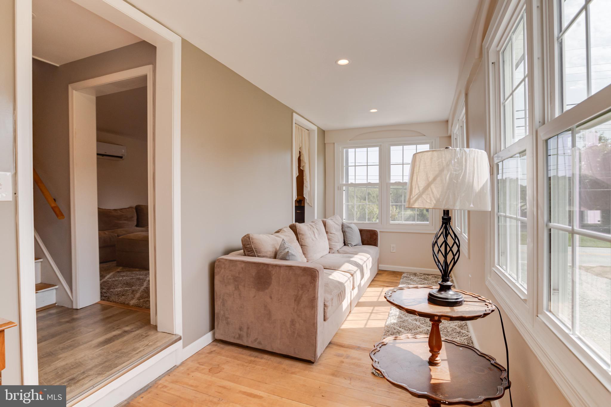 203 Blythedale Road Perryville, MD 21903 - Photo 23 of 104 a living room with furniture and a floor to ceiling window