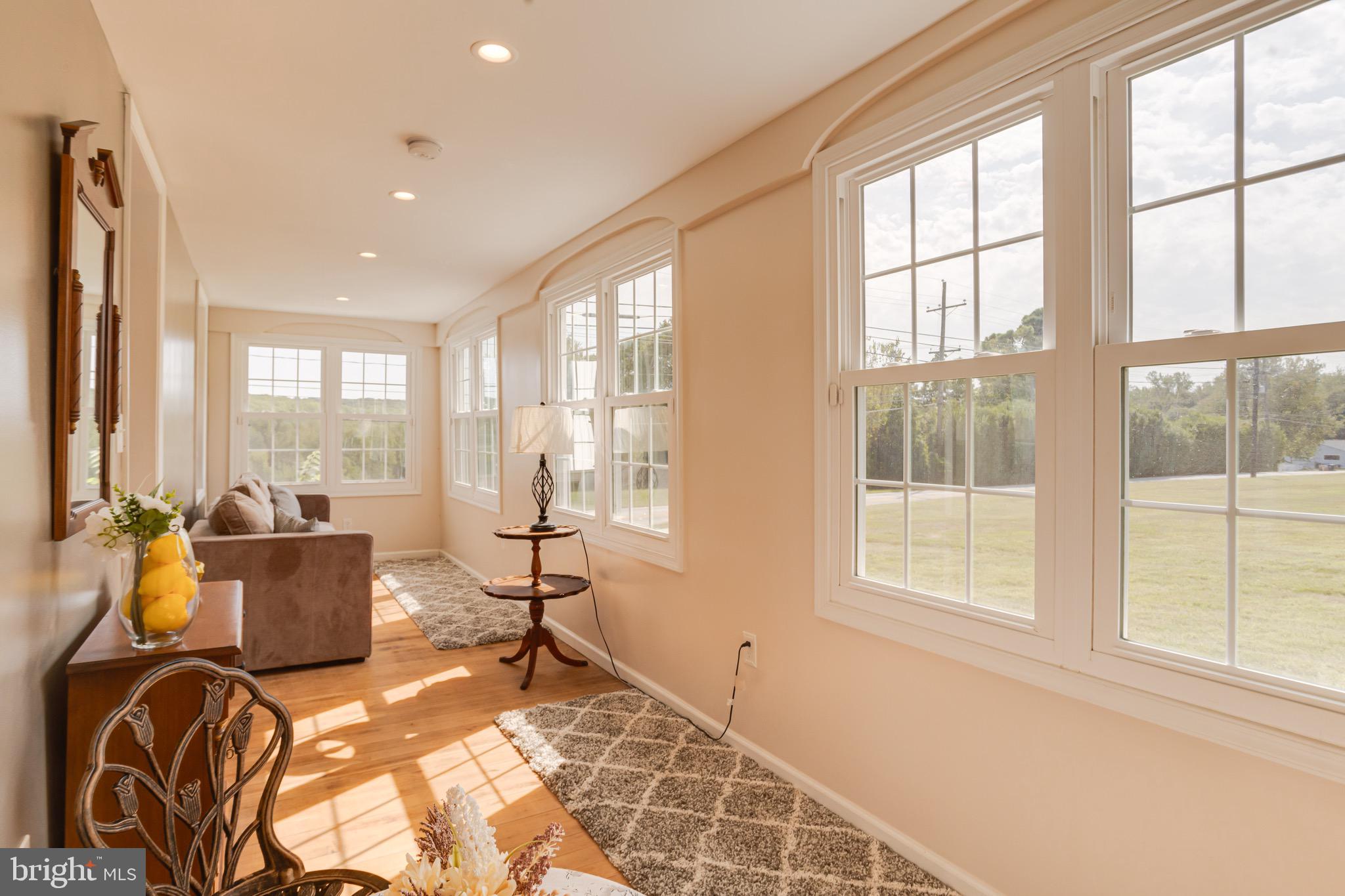 203 Blythedale Road Perryville, MD 21903 - Photo 25 of 104 a living room with furniture and floor to ceiling windows