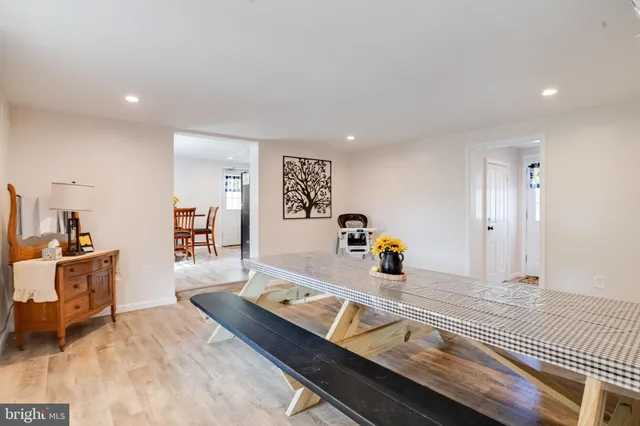 a large bed sitting in a room next to a window