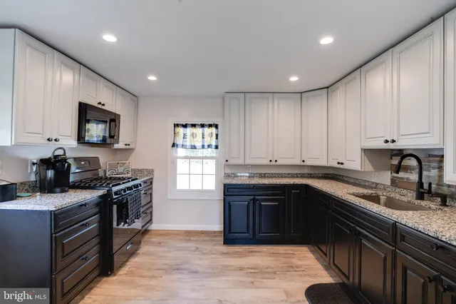 a living room with a bookshelf and a flat screen tv