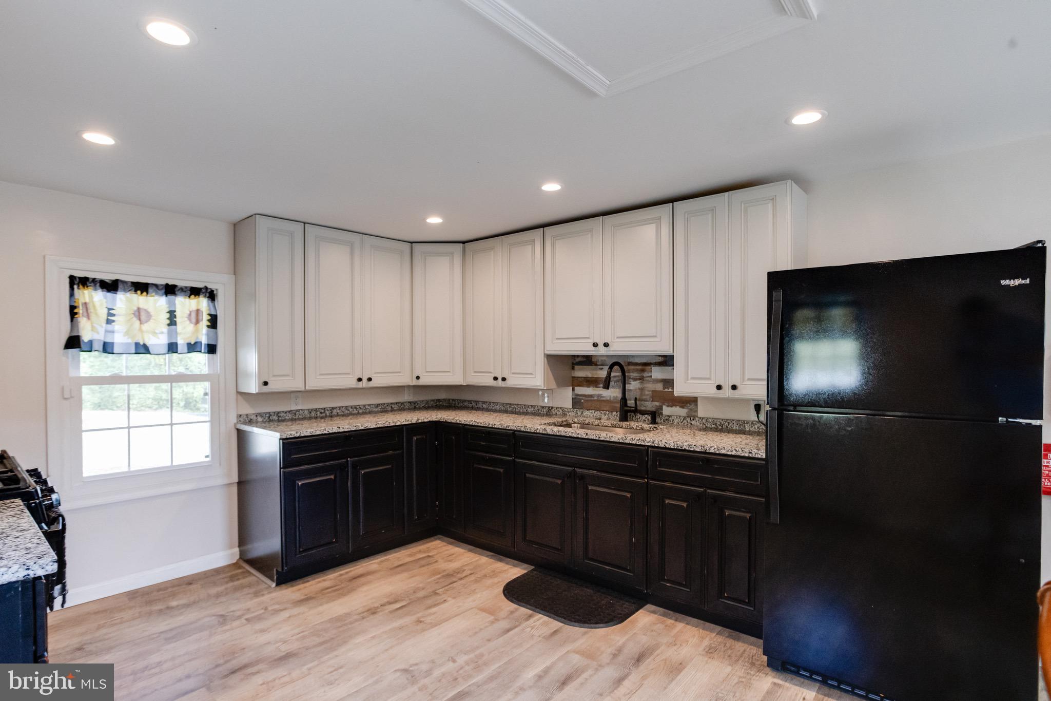 203 Blythedale Road Perryville, MD 21903 - Photo 42 of 104 a kitchen with stainless steel appliances granite countertop a sink stove and refrigerator