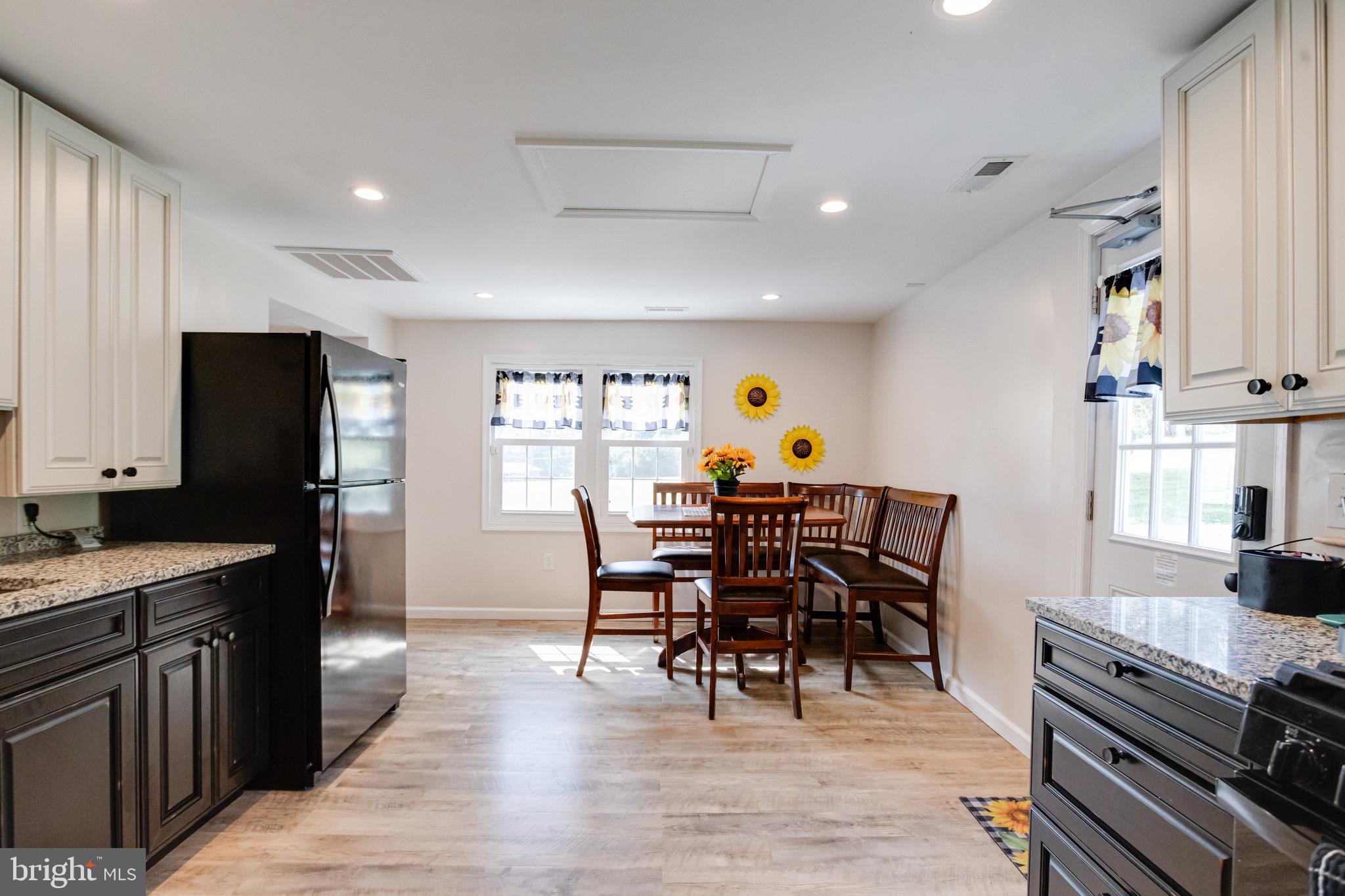203 Blythedale Road Perryville, MD 21903 - Photo 45 of 104 a view of a dining room with furniture a rug and wooden floor