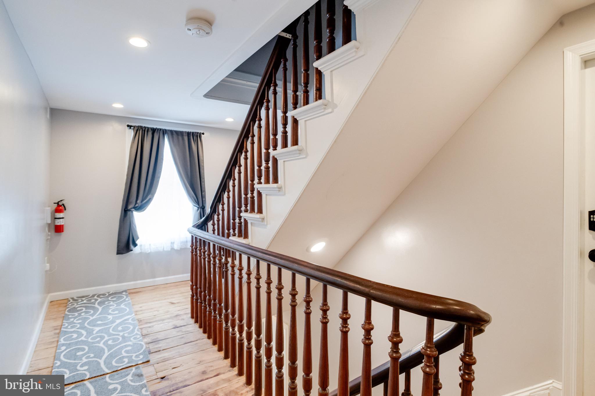 203 Blythedale Road Perryville, MD 21903 - Photo 47 of 104 a view of staircase with lots of frames on wall and wooden floor