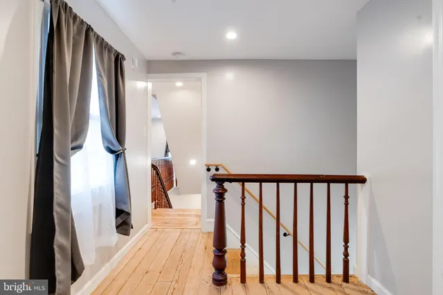 a view of a white house with a yard and garage