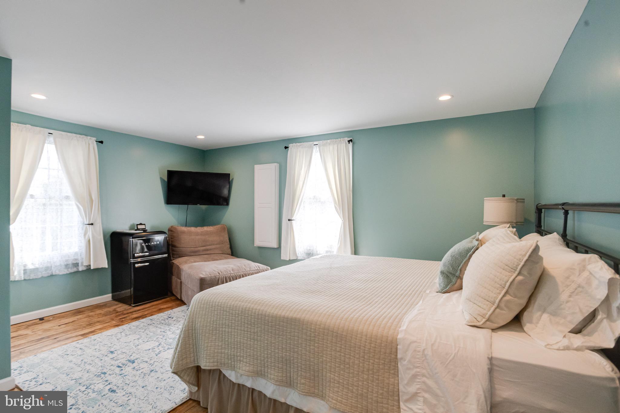 203 Blythedale Road Perryville, MD 21903 - Photo 51 of 104 a bedroom with a bed and a flat screen tv