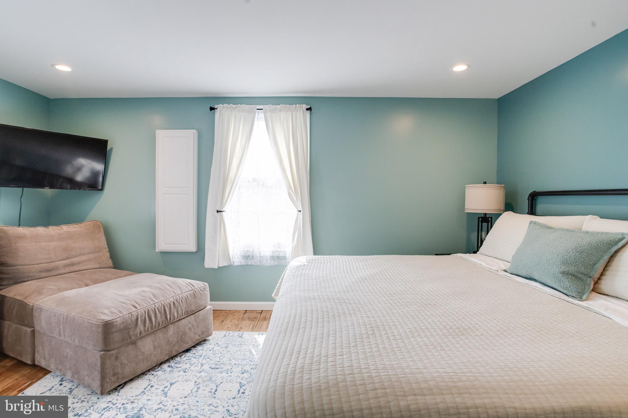 203 Blythedale Road Perryville, MD 21903 - Photo 52 of 104 a bedroom with a bed and a flat screen tv