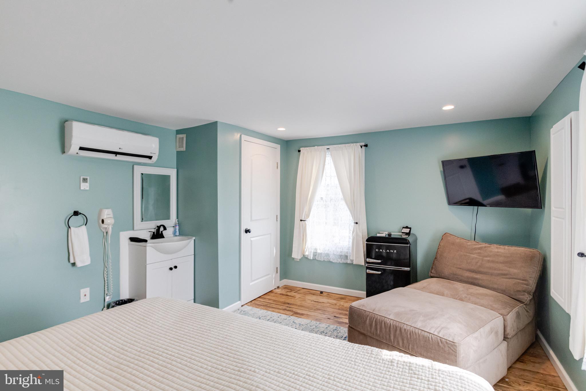 203 Blythedale Road Perryville, MD 21903 - Photo 55 of 104 a bedroom with a bed and a flat screen tv