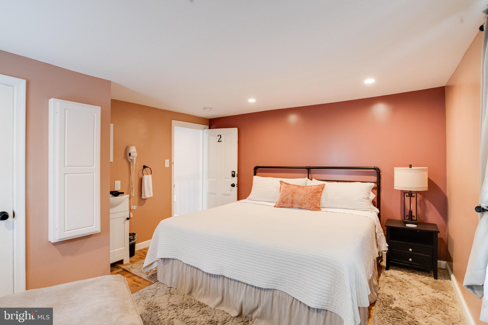 203 Blythedale Road Perryville, MD 21903 - Photo 61 of 104 a bedroom with a bed and a lamp