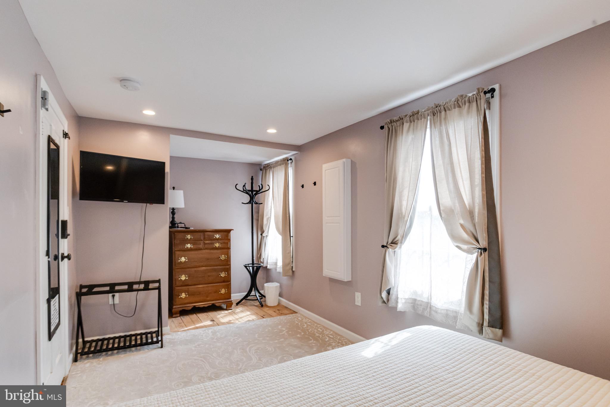 203 Blythedale Road Perryville, MD 21903 - Photo 66 of 104 a bedroom with a bed and a flat screen tv