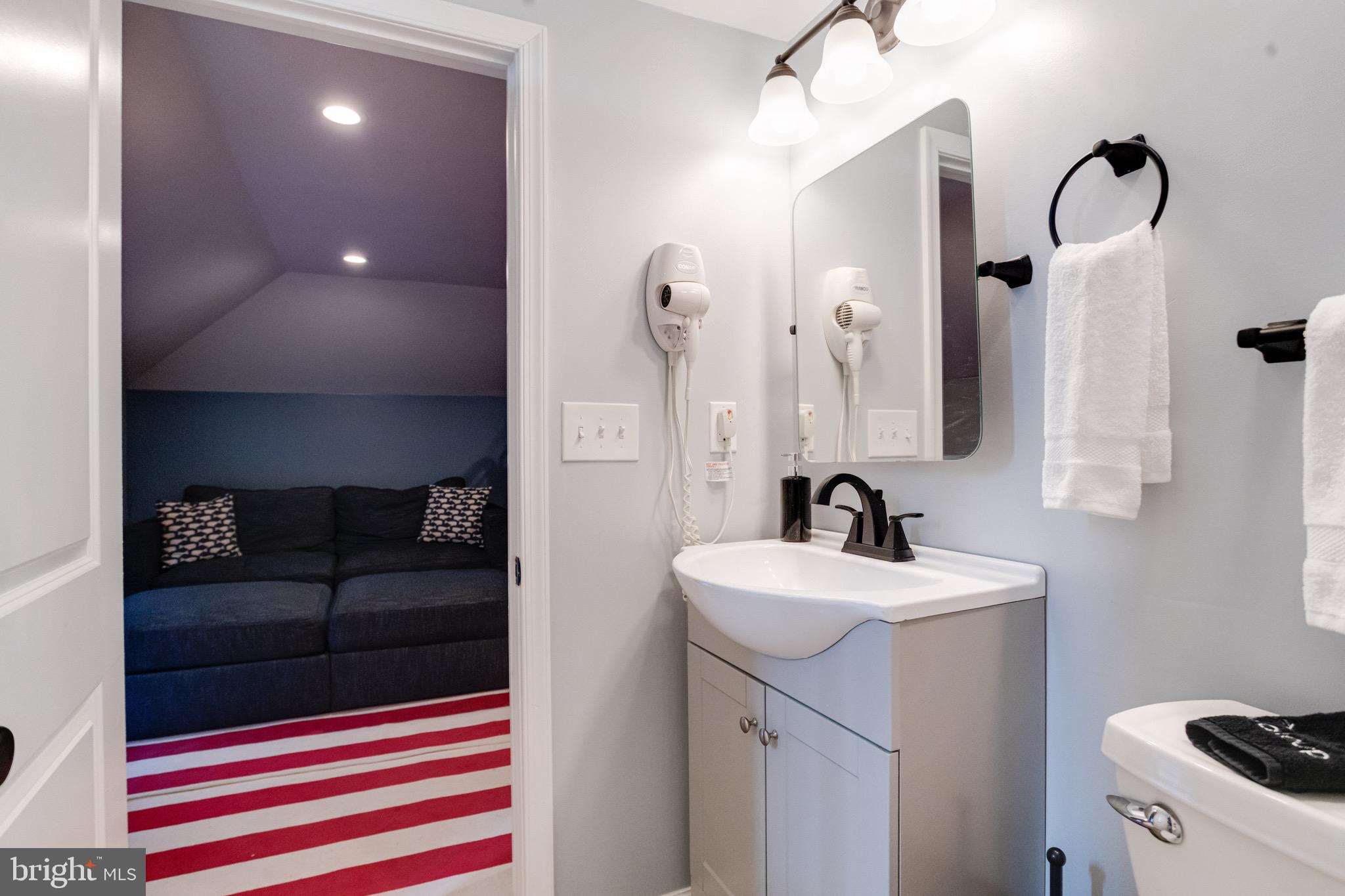203 Blythedale Road Perryville, MD 21903 - Photo 75 of 104 a bathroom with a sink and a mirror