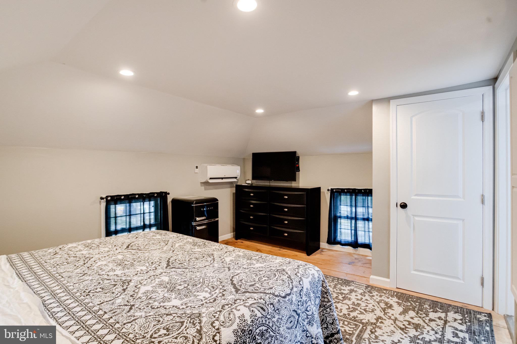 203 Blythedale Road Perryville, MD 21903 - Photo 83 of 104 a bedroom with a dresser and a flat screen tv
