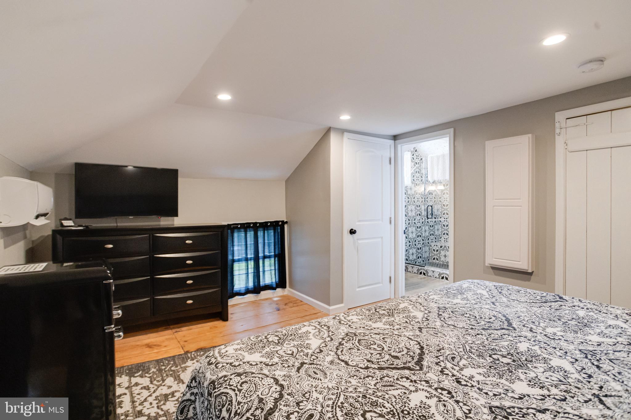 203 Blythedale Road Perryville, MD 21903 - Photo 87 of 104 a bedroom with a bed and a flat screen tv