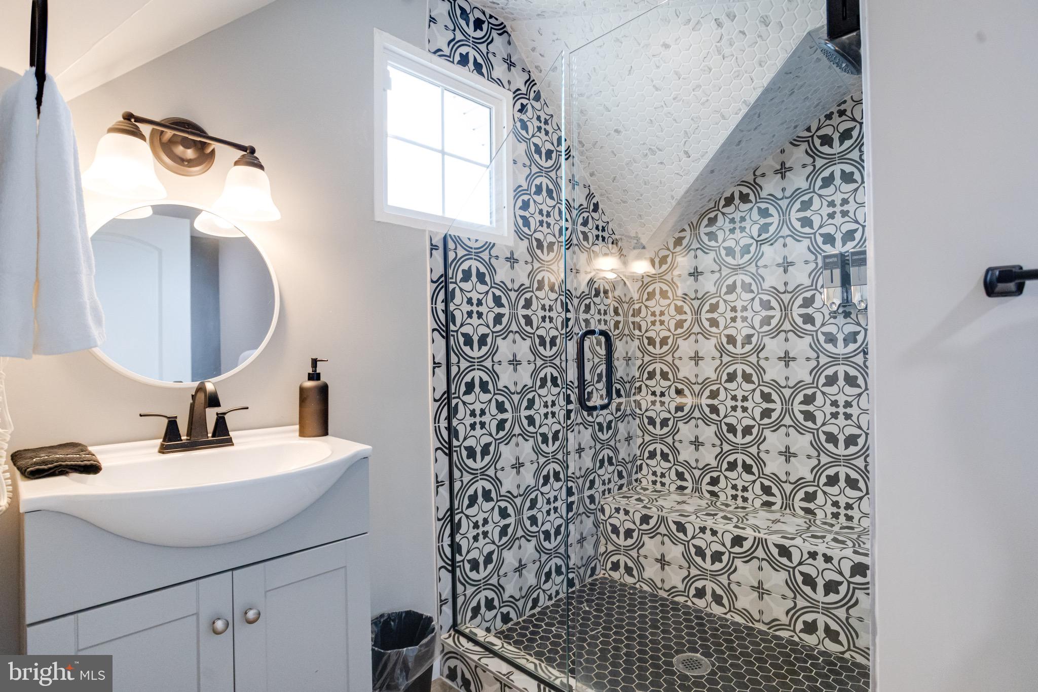 203 Blythedale Road Perryville, MD 21903 - Photo 88 of 104 a bathroom with a sink a mirror a vanity and a shower