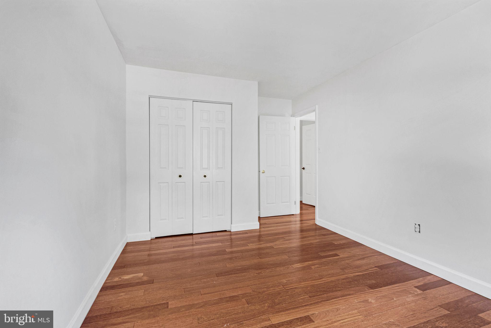 14422 Pebblestone Drive Silver Spring, MD 20905 - Photo 26 of 37 a view of an empty room with wooden floor