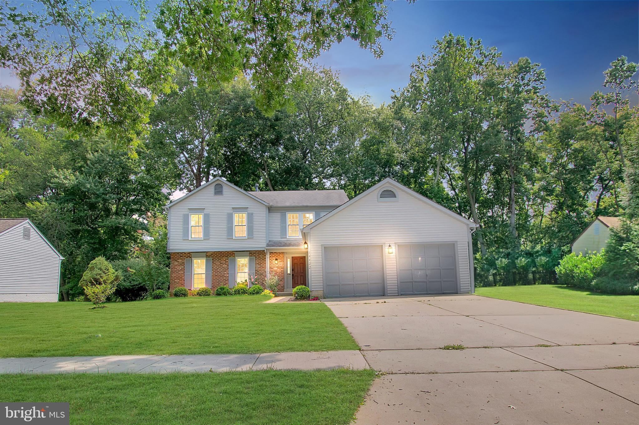 14422 Pebblestone Drive Silver Spring, MD 20905 - Photo 37 of 37 a front view of a house with a yard and garage