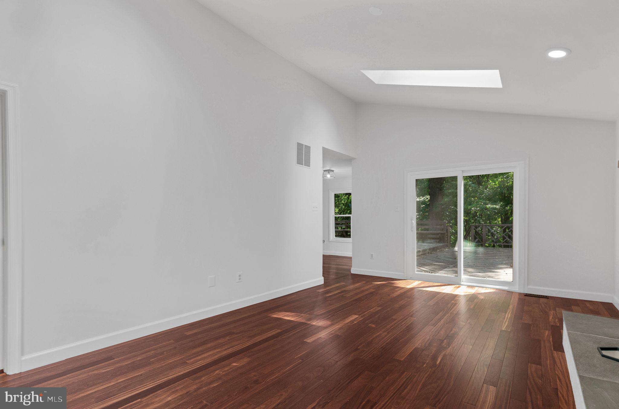 14422 Pebblestone Drive Silver Spring, MD 20905 - Photo 9 of 37 wooden floor in an empty room with a window