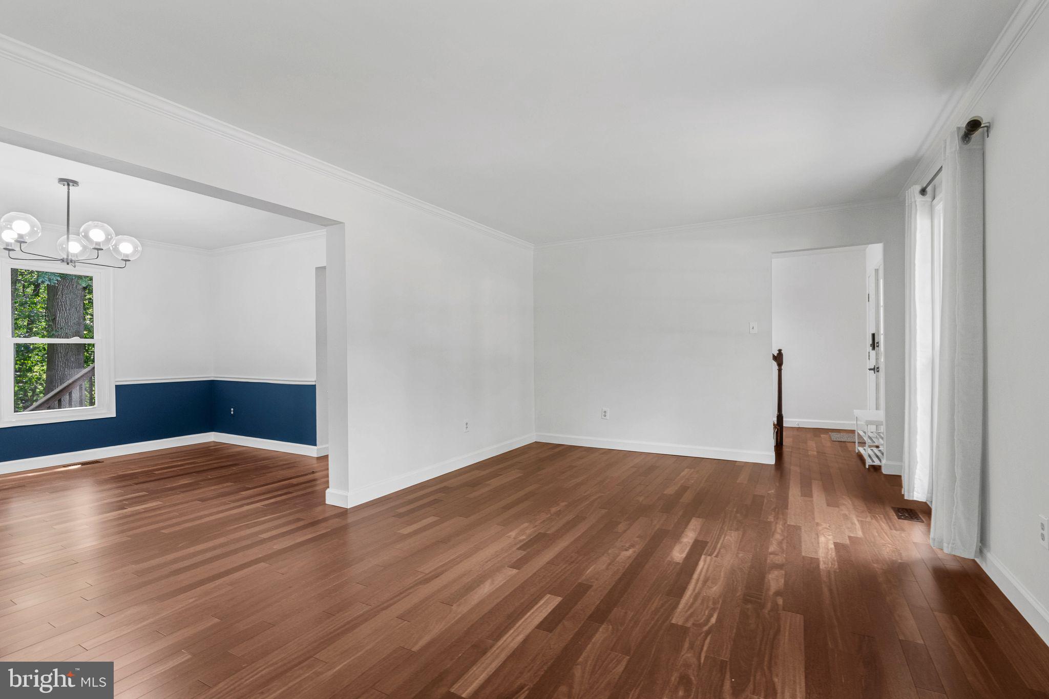 14422 Pebblestone Drive Silver Spring, MD 20905 - Photo 10 of 37 a view of empty room with wooden floor and window