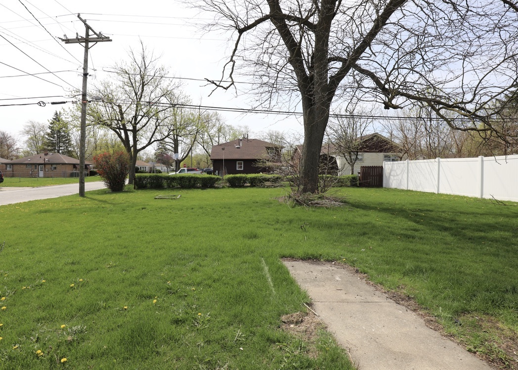 2207 175th Street Homewood, IL 60430 - Photo 12 of 13 a view of a backyard with large trees