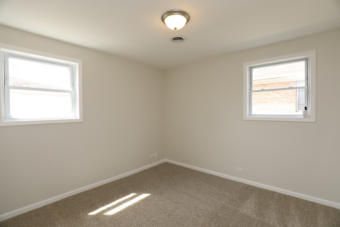 2207 175th Street Homewood, IL 60430 - Photo 5 of 13 an empty room with a window